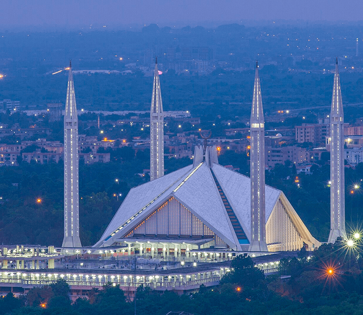 Faisal Mosque in Islamabad at night, featured in the Cyrus One guide to landmarks worth the drive.